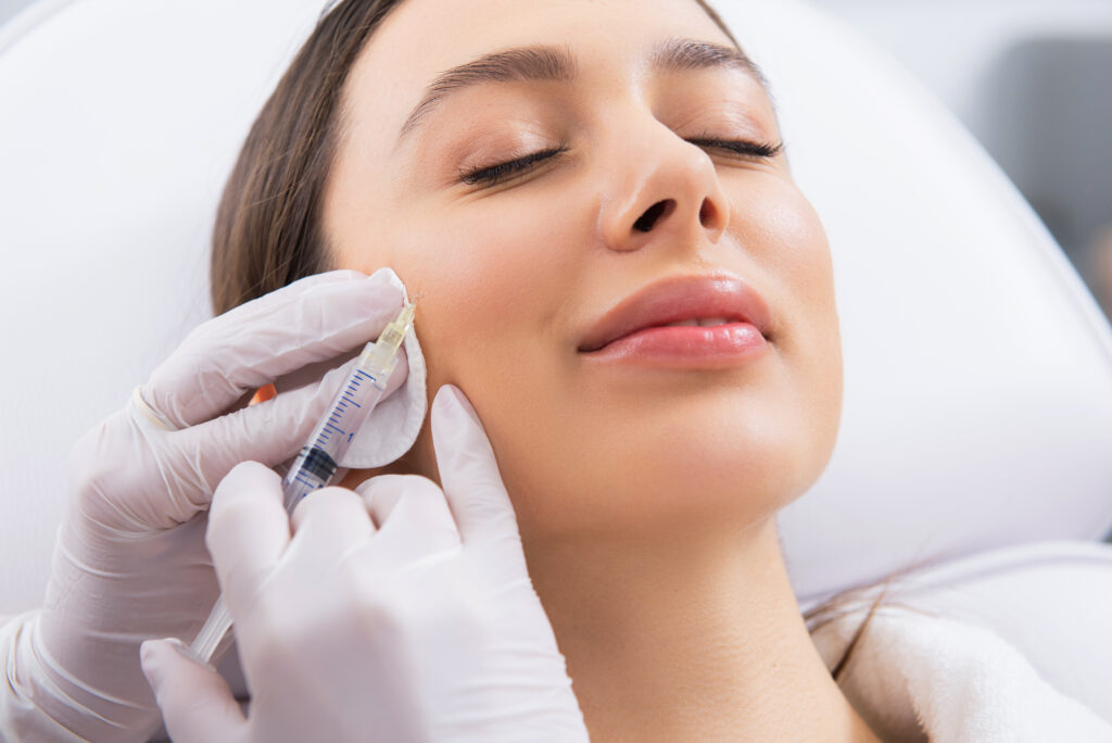 Woman with serene expression receiving preventative Botox injections